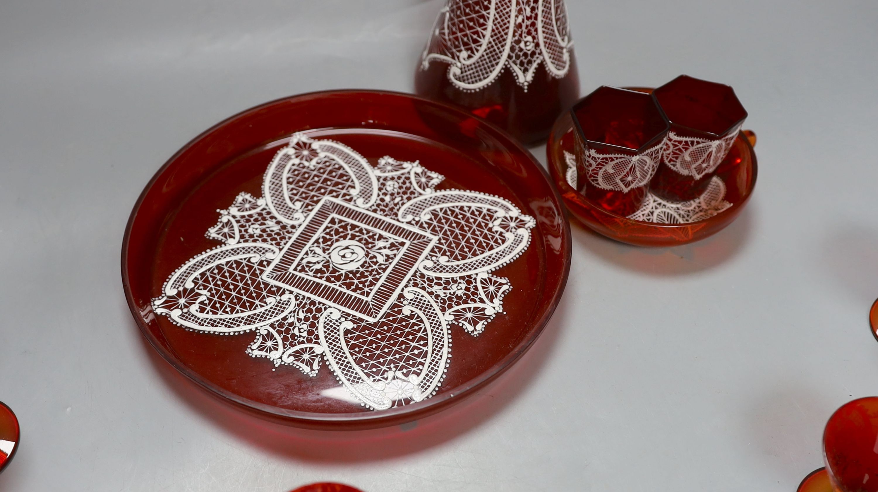 A Venetian red enamelled glass lace-pattern liqueur set